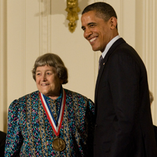 Yvonne C. Brill poses with President Barack Obama