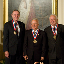 Federico Faggin; Marcian E. Hoff, Jr.; and Stanley Mazor shake hands with President Barack Obama