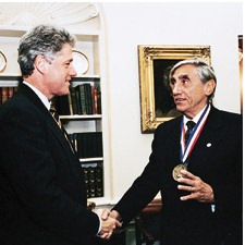 H. Joseph Gerber shakes hands with President Bill Clinton